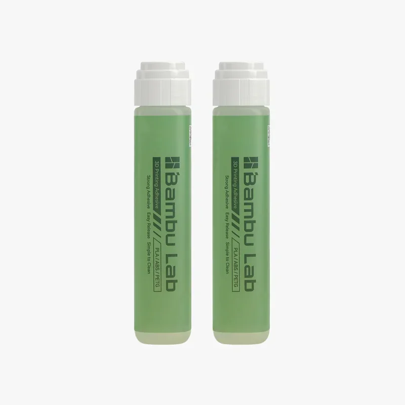 Bambu Lab green adhesive bottles for 3D printers, labeled for PLA/ABS/PETG, featuring strong adhesion and easy release properties.