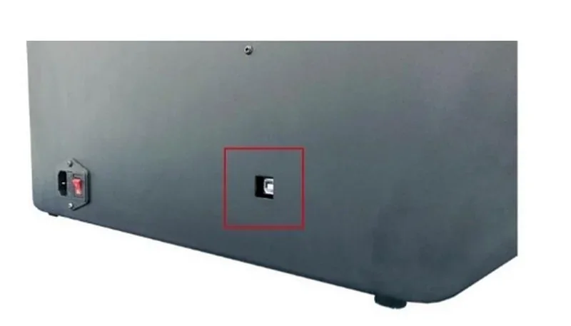 Black Intamsys Funmat HT surface with a red-highlighted port, showcasing design detail and structure of the 3D printer.