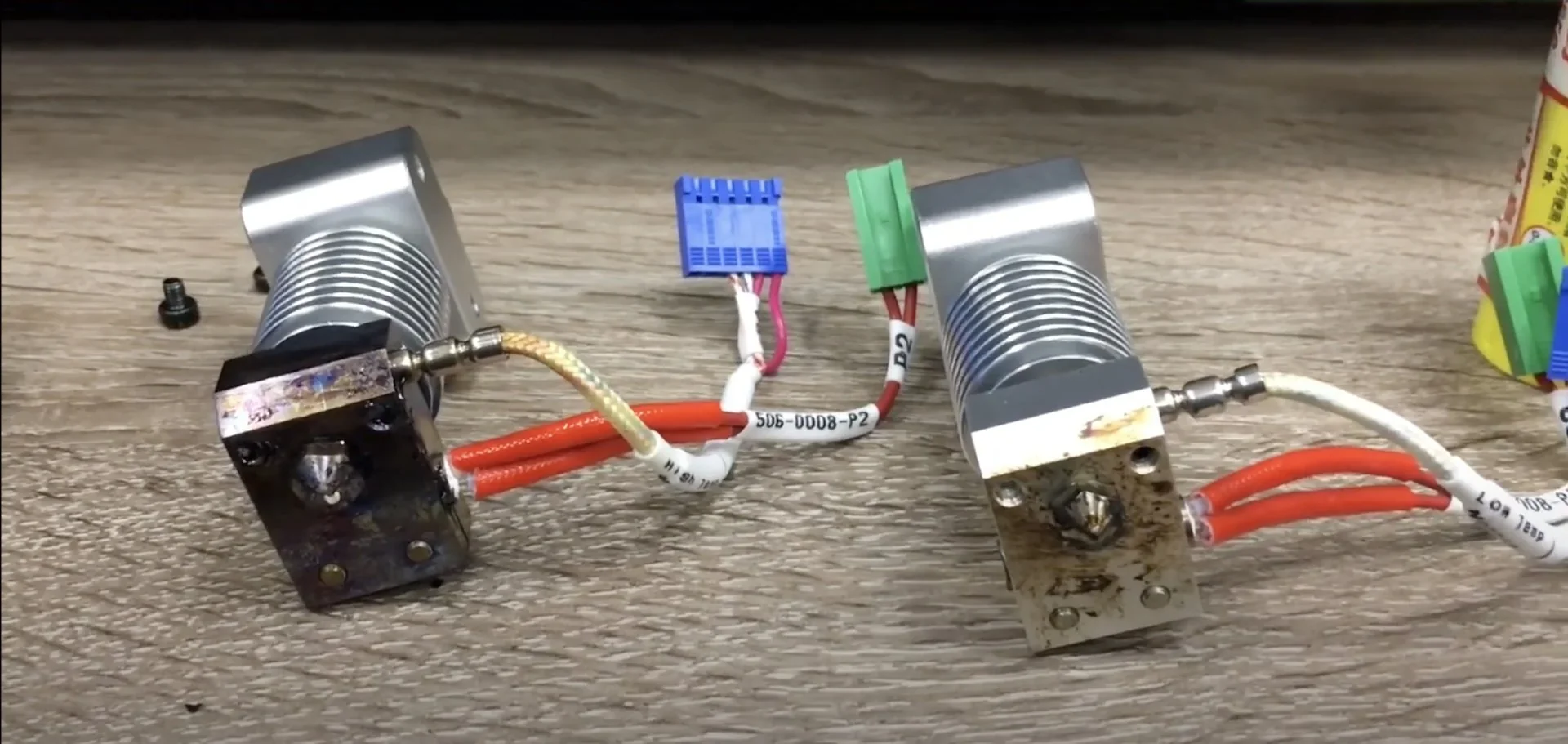 intamsys funmat ht nozzle parts on a wooden surface, featuring wiring and connectors, showcasing 3D printer components.