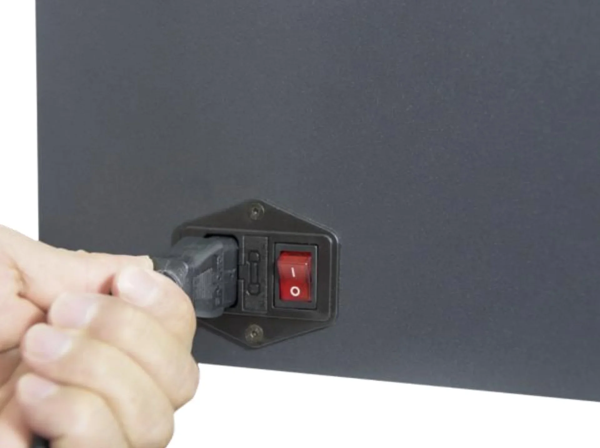 Hand plugging power cord into the back of Intamsys Funmat HT 3D printer with a visible red power switch.