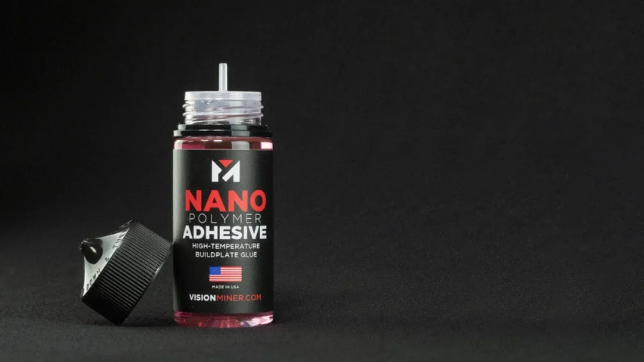 Bottle of Nano Polymer Adhesive with black cap on a dark background, used for high-temp 3D printing with Intamsys Funmat HT.