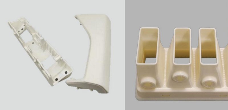 Two 3D-printed parts displayed side by side on a neutral background. On the left, an elongated and curved structure with multiple attachment points demonstrates complex geometry. On the right, a rectangular base with four vertical, square-shaped columns, each featuring a circular indentation at the bottom. Both components are created by the Intamsys Funmat Pro 310, indicating its capability to produce detailed and intricate objects.