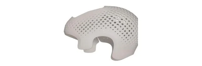 3D-printed white helmet with perforated design, created by Intamsys Funmat Pro 310.
