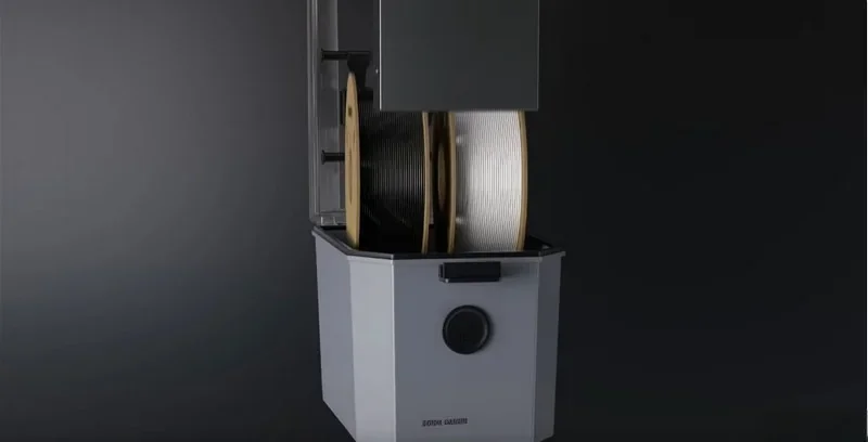 Intamsys Funmat Pro 310 shows a sleek 3D printer with filament spools. Its modern design suggests high-performance printing in a professional setting.