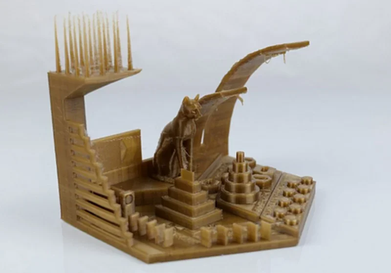 3D printed CAT and geometric structures on a test model created by the intamsys funmat pro 410, showcasing detail and precision on a white background.