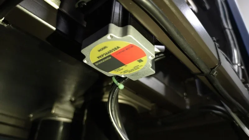 Intamsys Funmat Pro 410 stepper motor and wiring detail, highlighting the precision engineering inside the 3D printer's mechanical system.