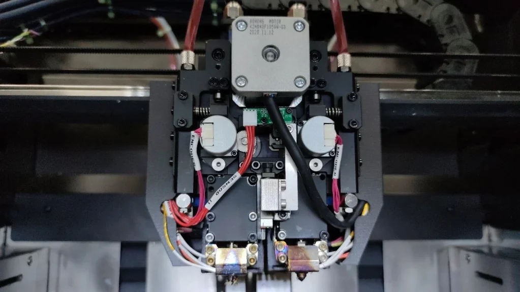 Intamsys Funmat Pro 410 printer detail showing intricate wiring and components, highlighting advanced mechanical structure for high-performance 3D printing.