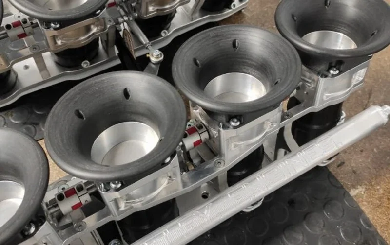 Intamsys Funmat Pro 610 HT 3D printed engine parts with metallic and black components, highlighting precision engineering and manufacturing.