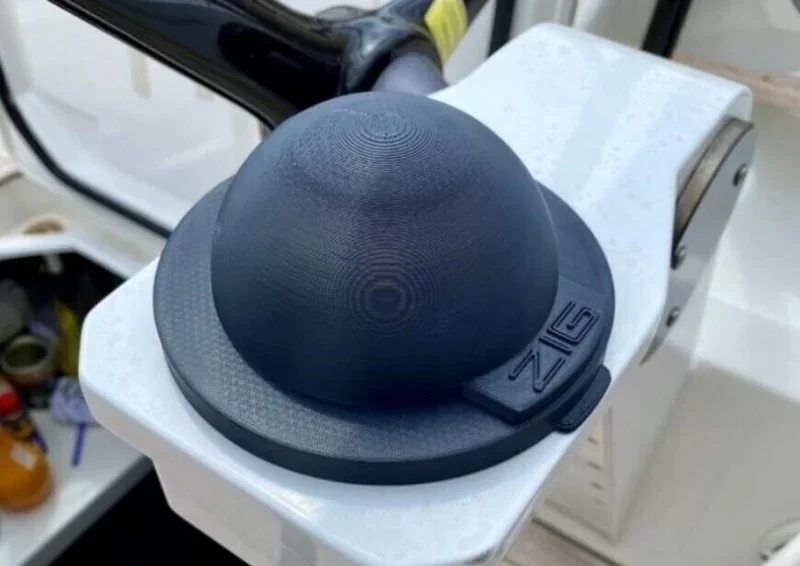 3D printed black dome-shaped part on a boat deck made by Intamsys Funmat Pro 610 HT. Branding visible.