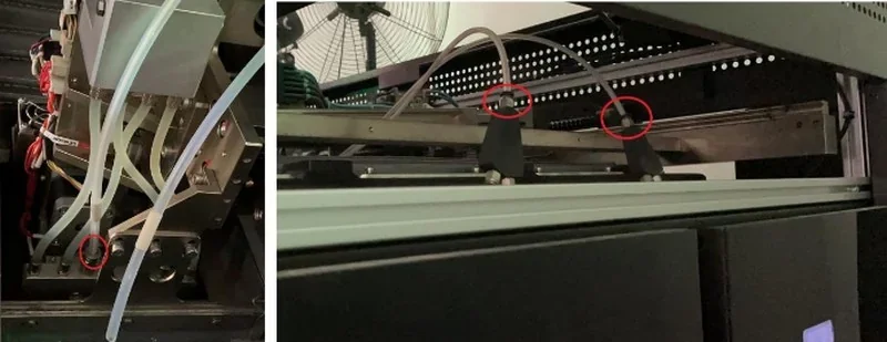 Industrial components inside Intamsys Funmat Pro 610 HT; tubing and mechanical parts, highlighted in red, indicate precise 3D printer mechanism.