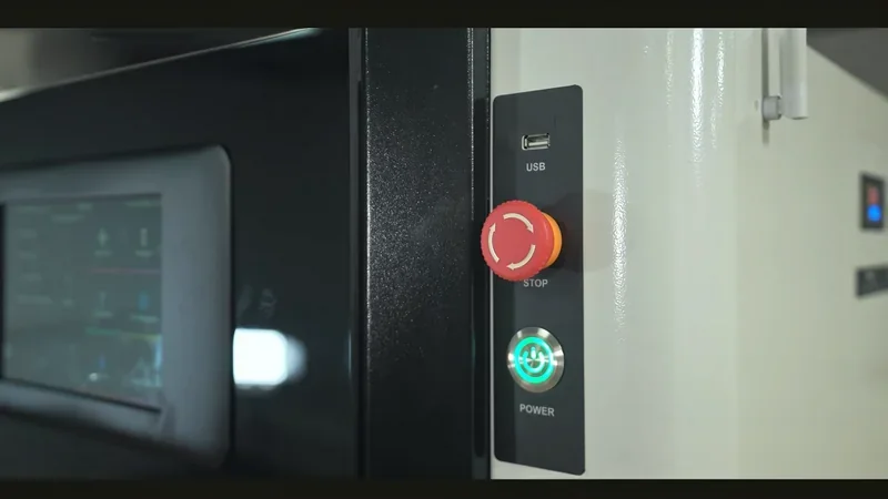 Mingda MD-1000D 3D printer panel with USB port, red stop button, and illuminated power button; partial view of control screen in the background.