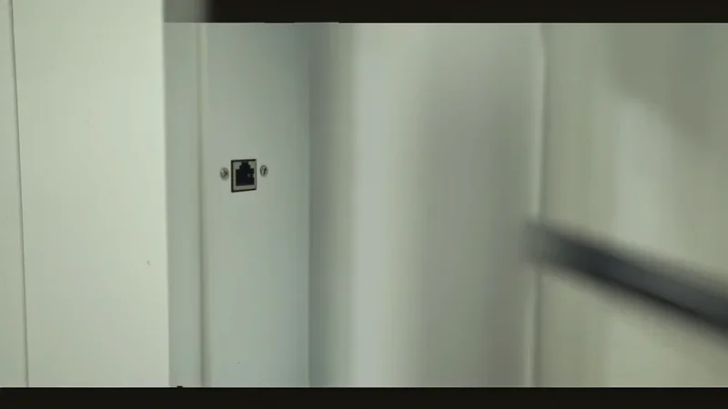 Ethernet port on white panel of Mingda MD-1000D 3D printer, highlighting connectivity feature in a sleek interior setting, no samples visible.