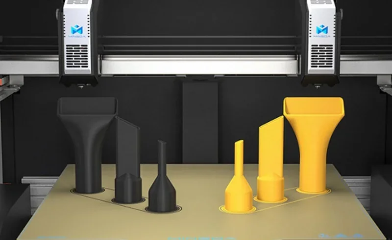 Mingda MD-400D 3D printer with black and yellow industrial parts printed, showcasing dual extruders and branded design.