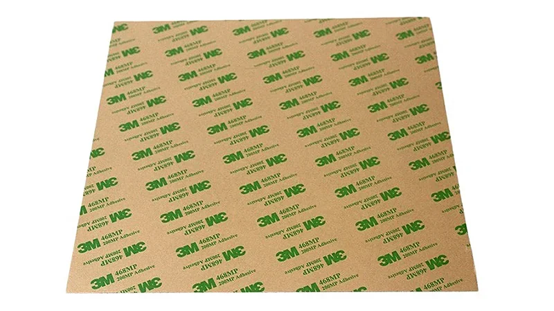 3M adhesive sheet for the Modix Big 120Z printer, featuring branded logos and text pattern on a flat brown surface.