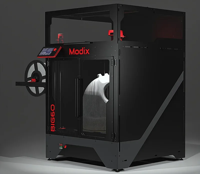 Modix Big 60 3D printer in a dark setting, showing large build volume with part inside. Black frame, red details, branding on side and control panel.