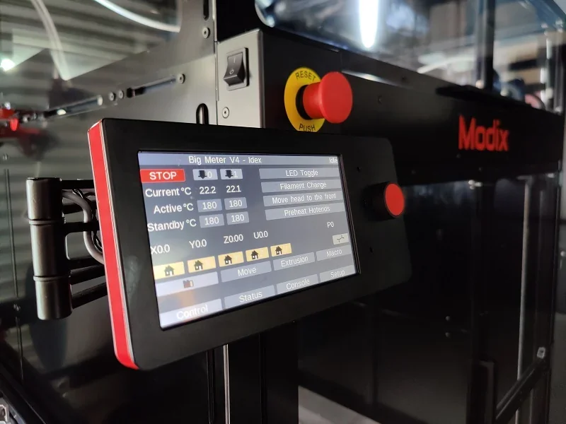 Modix Big 60 3D printer control panel with temperature settings and branding, showcasing technical interface in industrial setting.
