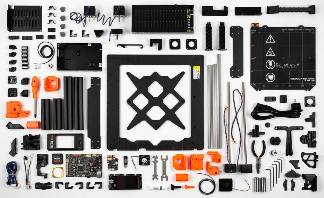 Original Prusa MK4S 3D Printer Kit parts laid out, including frame, motors, wiring, and control board, showcasing the assembly components.