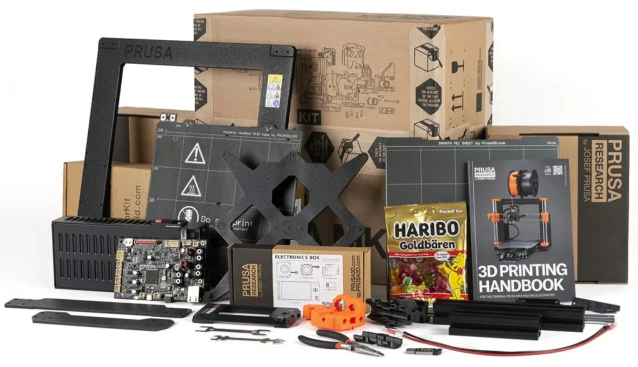 Original Prusa MK4S 3D Printer Kit components, including frame, electronics, handbook, and branded packaging against stacked boxes.