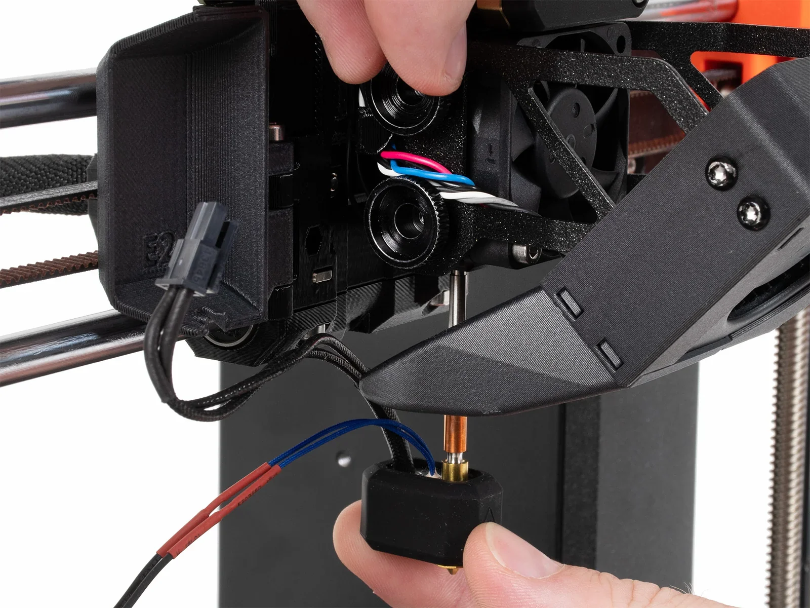 Original Prusa MK4S 3D printer kit showing detailed assembly of extruder components with visible wiring.