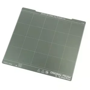 Original Prusa MK4S 3D Printer Kit heatbed, textured surface with grid lines, visible branding on bottom edge.