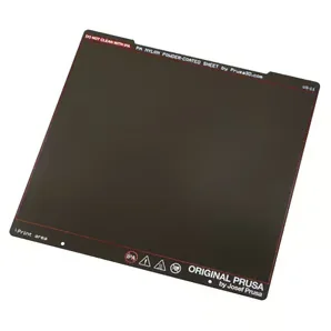 Original Prusa MK4S printer kit's powder-coated sheet with branding and instructions, essential for precise 3D printing results.