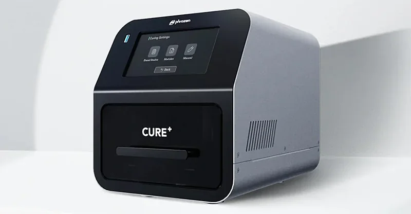 Phrozen Lumii DLP 3D printer in metallic finish, featuring touchscreen control and "CURE+" branding, designed for precise 3D printing tasks.