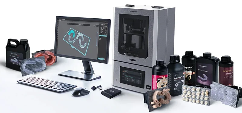 Phrozen Lumii DLP 3D printer setup with dental mold samples, resin bottles, computer displaying design, and branding visible.
