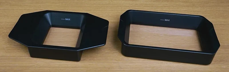 Phrozen Sonic CS+ black resin trays, labeled "MAX," on a wooden surface, showcasing different shapes indicating print capacity.