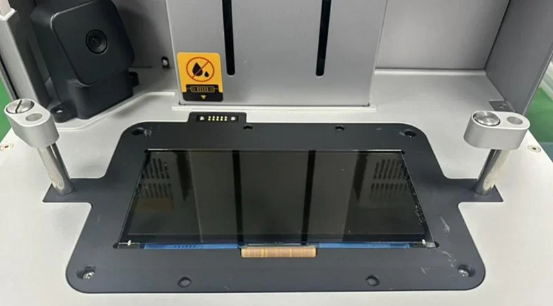 Phrozen Sonic CS+ printer vat shown with LCD panel inside; gray metal frame, black tray, and warning sticker visible on top.