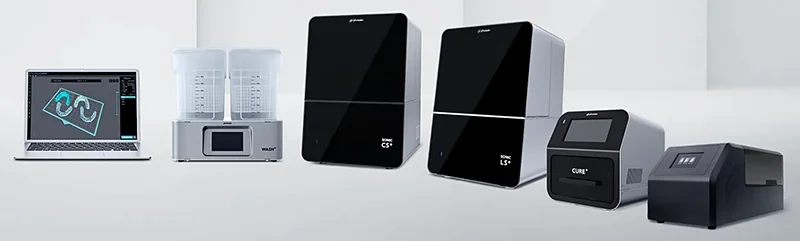 Phrozen Sonic CS+ 3D printer setup includes laptop software, two wash stations, additional curing units, and sleek black printer design in minimalistic setting.