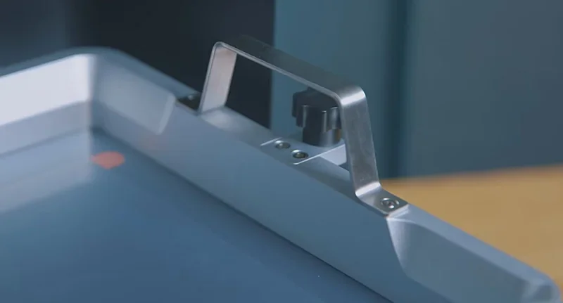 Metallic handle detail on Phrozen Sonic Mega 8K 3D printer vat, showcasing sleek design and build quality.