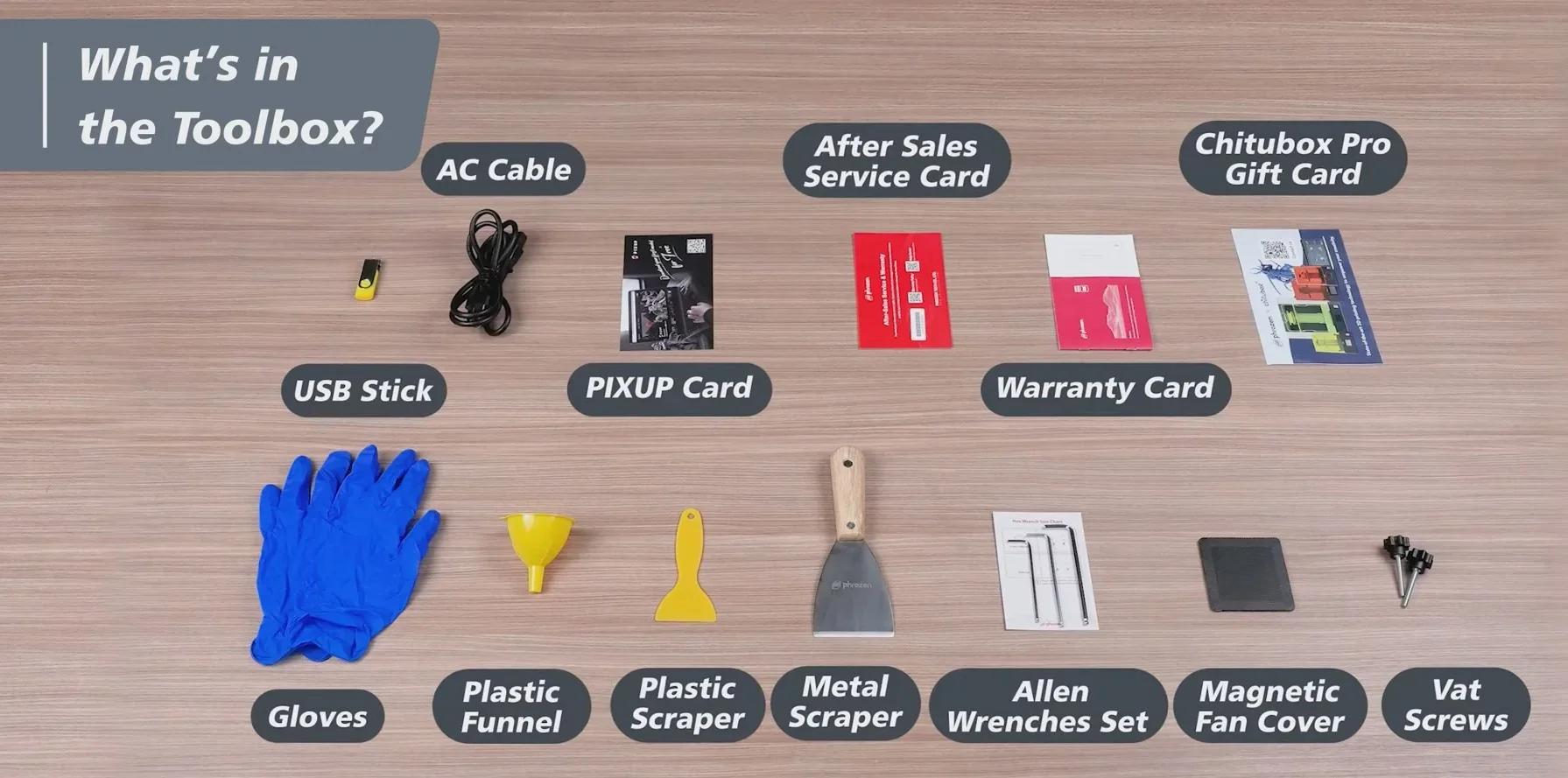 Phrozen Sonic Mega 8K accessories: AC cable, USB stick, gloves, scraper, funnel, warranty card, and more on a wooden surface.