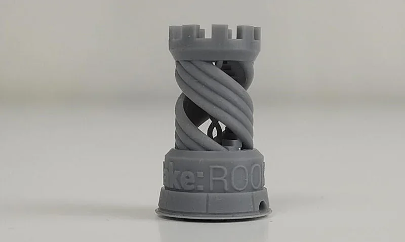 Phrozen Sonic Mega 8K V2 printed a detailed gray chess rook with a twisted spiral design, showcasing intricate 3D printing capabilities.