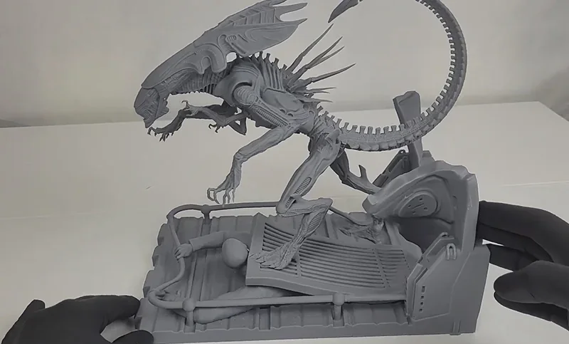 3D printed alien figure on detailed base, created by Phrozen Sonic Mega 8K V2.