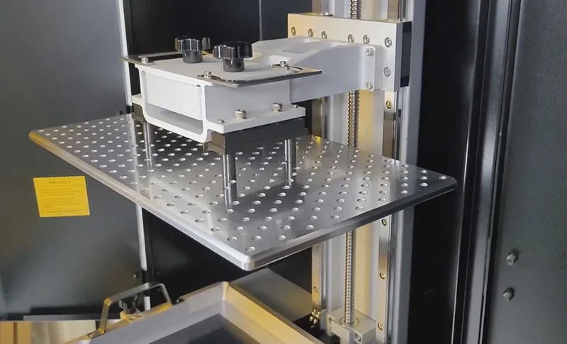Phrozen Sonic Mega 8K V2 3D printer build plate and Z-axis screw mechanism in operation.