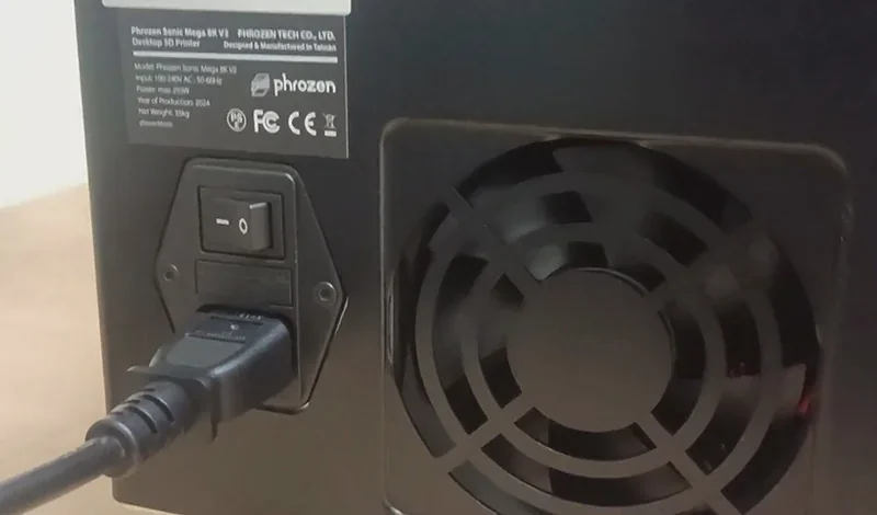 Phrozen Sonic Mega 8K V2 3D printer rear view with power switch, fan, and visible branding label.