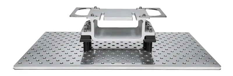 Phrozen Sonic Mega 8K V2 printer part shown on a perforated metal plate, showcasing the build quality and precision components of the 3D printer.