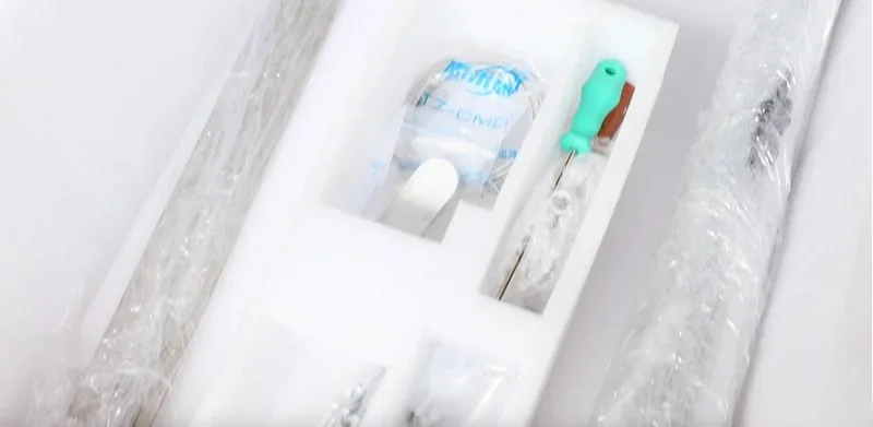 Packaging contents of the Piocreat G12 3D printer, including tools and spare parts organized in foam with visible branding.