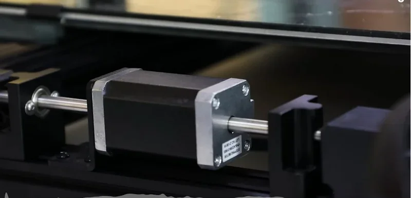 Piocreat G5 close-up of linear motion mechanism showcasing precision engineered components within a black frame, highlighting its advanced 3D printing capabilities.