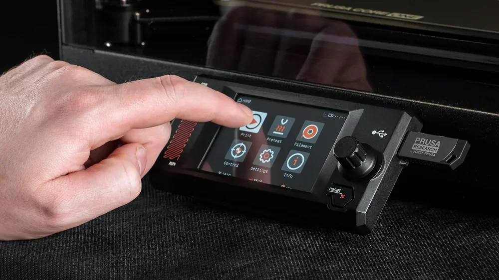 Prusa Core One touchscreen interface with hand interacting, showcasing print settings and controls; Prusa branding visible, part creation enabled.