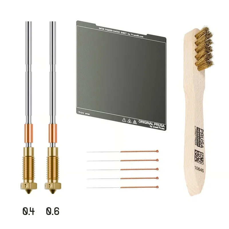 Prusa Core One accessories: two nozzles (0.4 and 0.6), print sheet, cleaning brush, nozzle cleaning tools.
