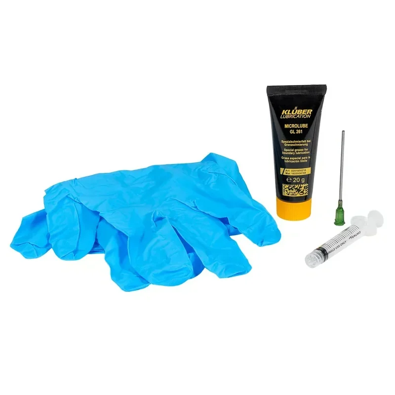 Blue gloves, lubricant, needle, and syringe set for Prusa Core One 3D printer, emphasizing maintenance and tool preparation essentials.