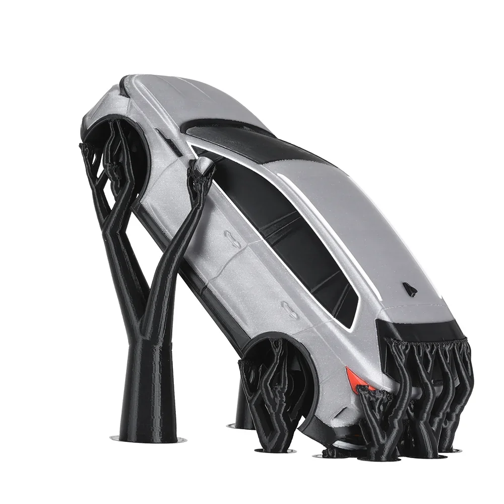 3D-printed car model with supports, created by Prusa Core One, showcasing detailed architecture and stability, featuring black support structures.