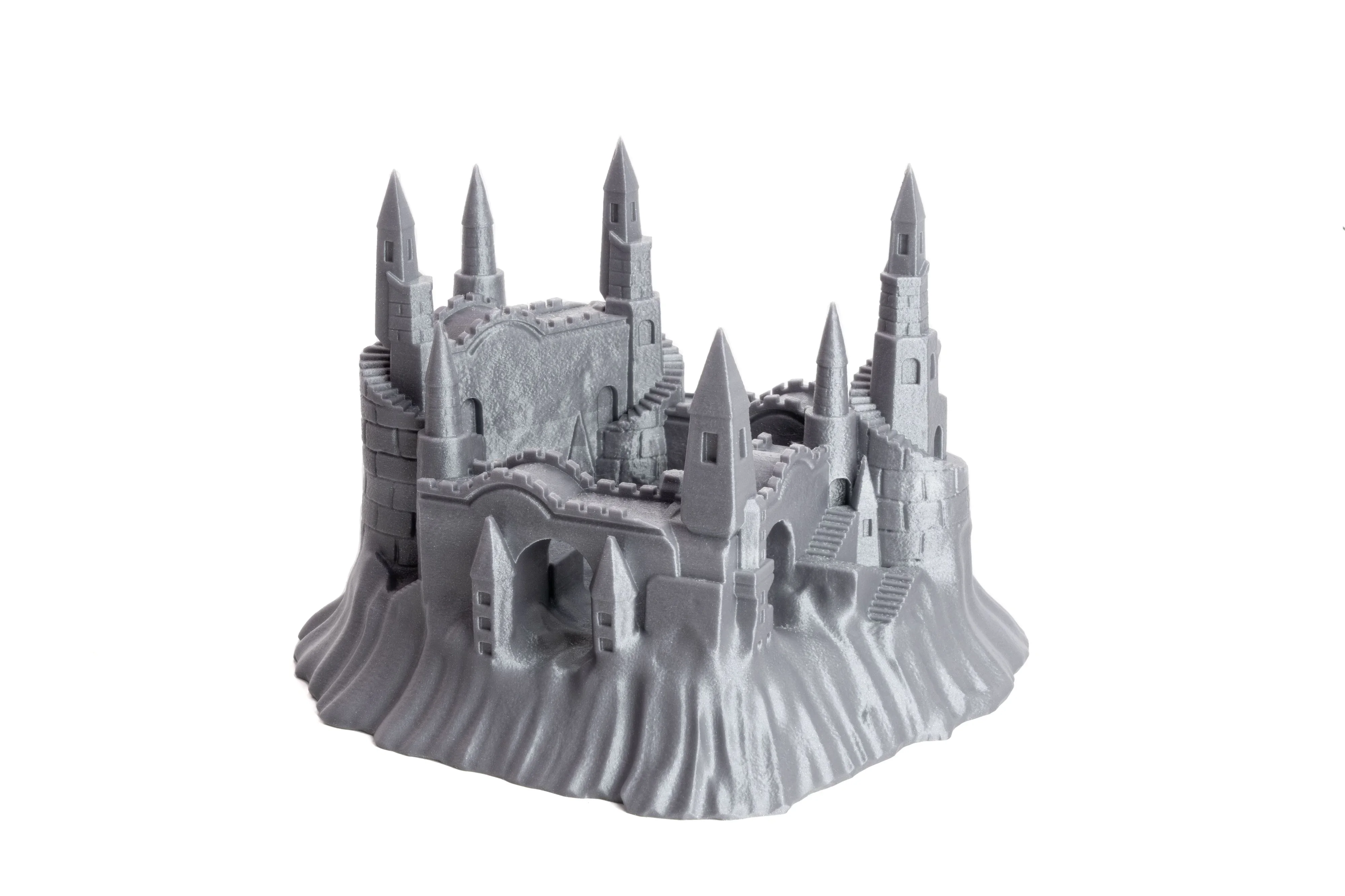 Gray 3D-printed castle model with towers and stairs, created by Prusa MK4 printer.