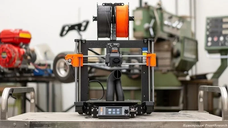 Prusa MK4 3D printer in a workshop setting, showcasing dual filament spools and parts created by the printer.