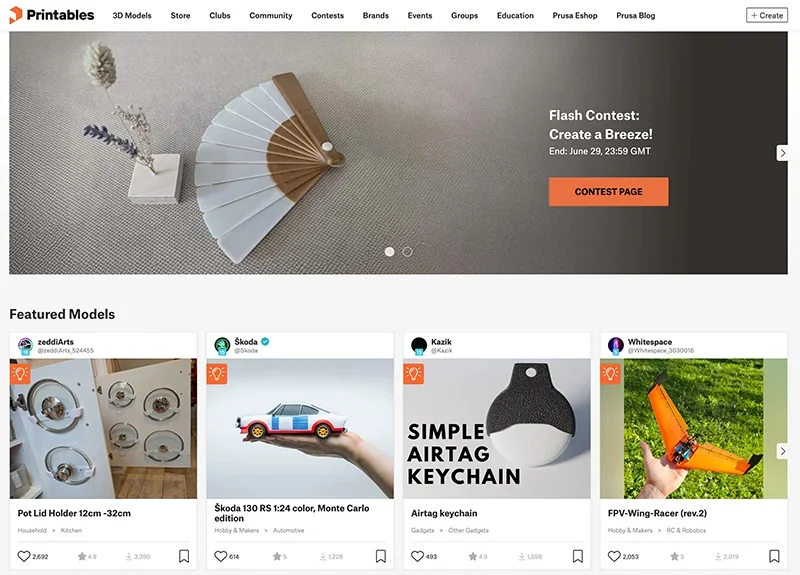 Featured 3D printed models include a Škoda car and a keychain, likely created with Prusa SL1S, displayed on the Printables website.