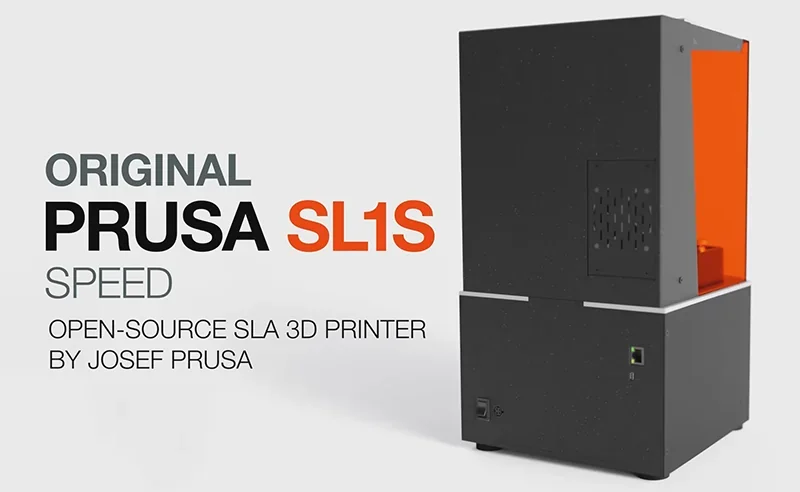 Prusa SL1S 3D printer with black and orange design, displaying branding and features text against a plain background.