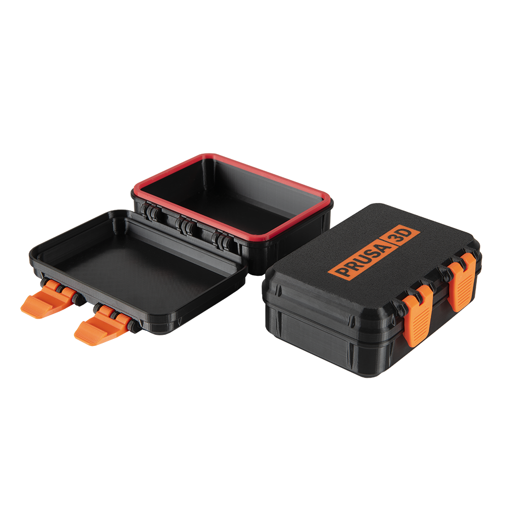 Prusa XL 3D-printed black and orange storage boxes, one open, showcasing compact design and Prusa 3D branding.