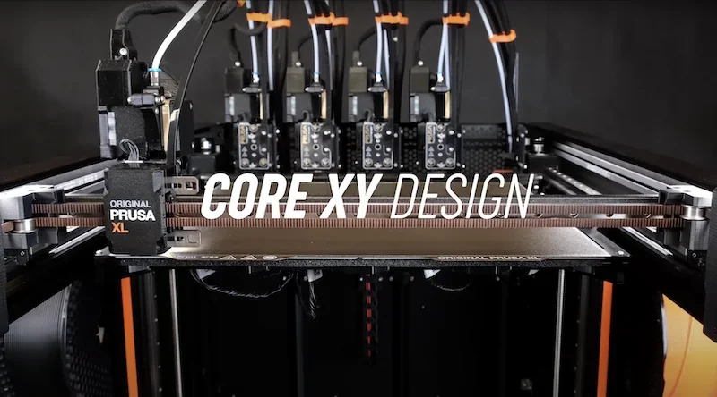 Prusa XL 3D printer with Core XY design, showcasing multiple extruders and branding, illustrating advanced printing capabilities.