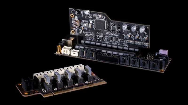 Prusa XL circuit boards on black background, featuring components and connectors, showcasing advanced electronics for 3D printing technology.